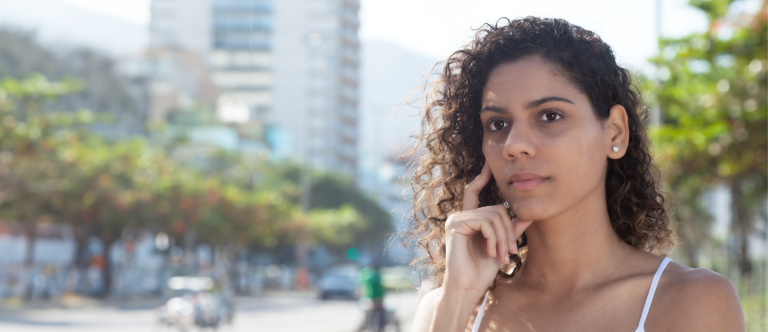 young ambiguous woman contemplating her options